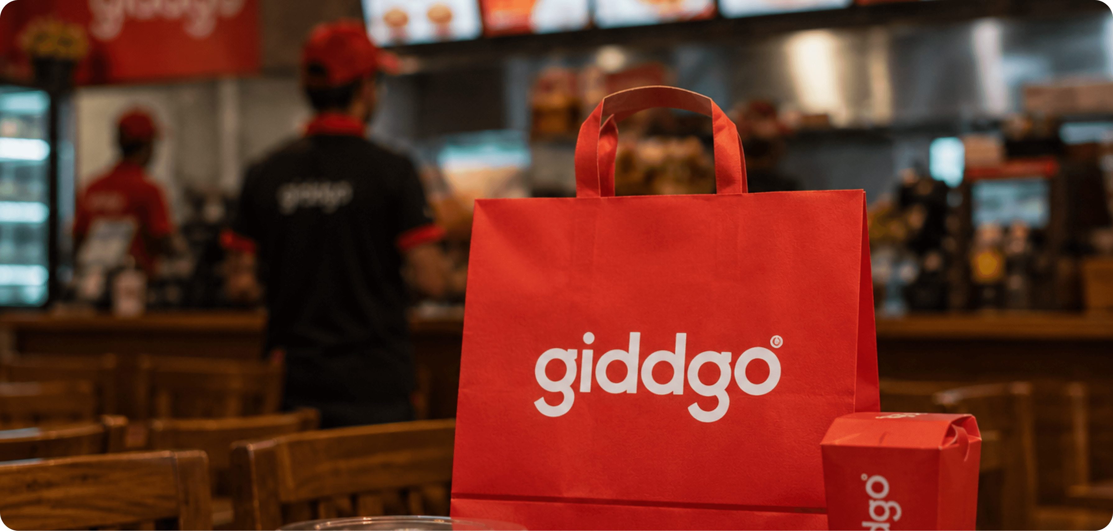 A Giddgo delivery bag on a restaurant counter