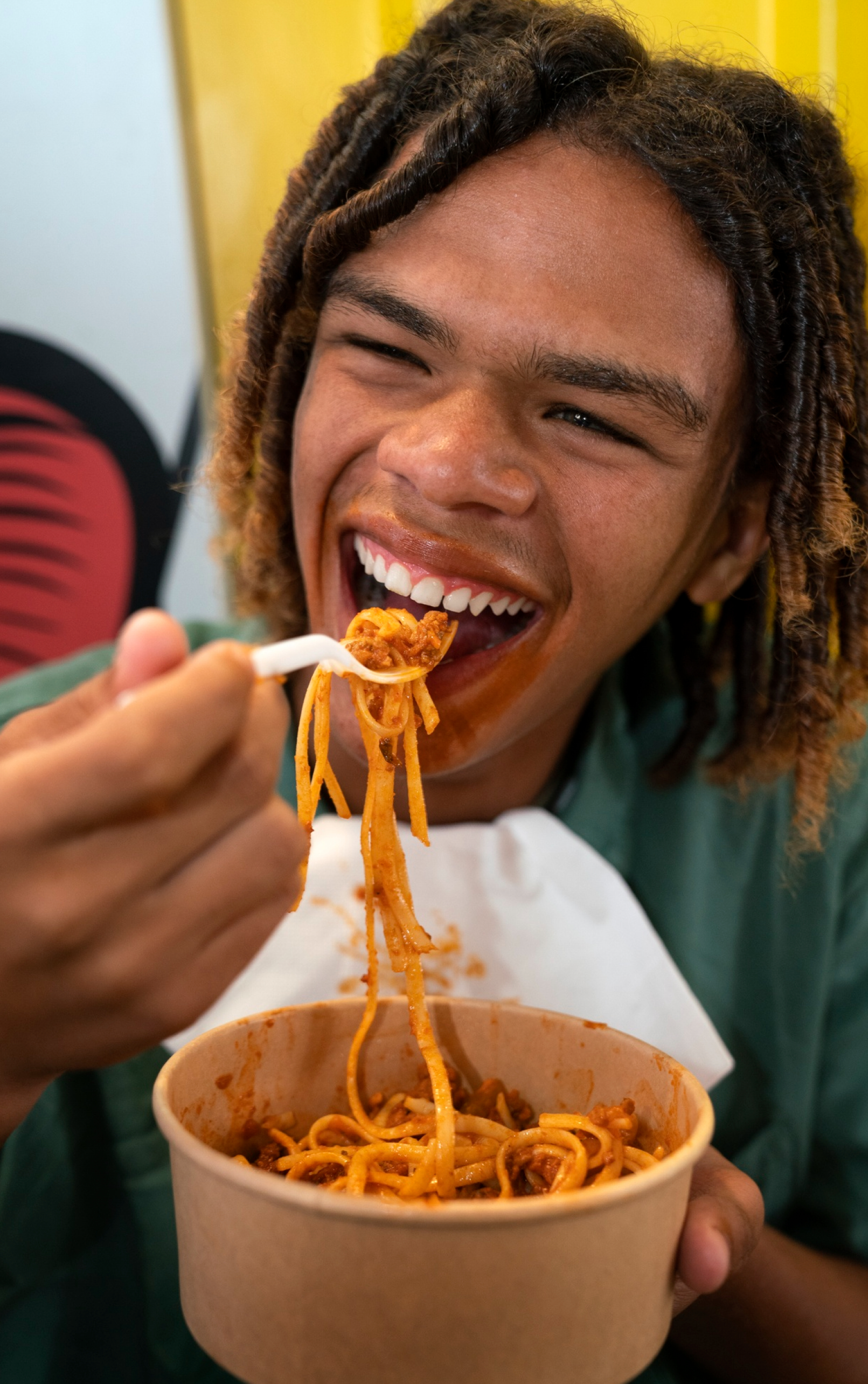 A happy customer enjoying a bowl of food